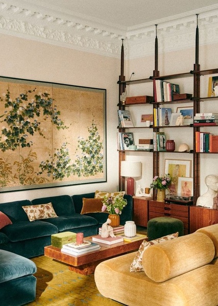 sofa, coffee table, bookshelf, living room decor, furniture set, lifestyle, calm, luxurious, neutral, green, brown